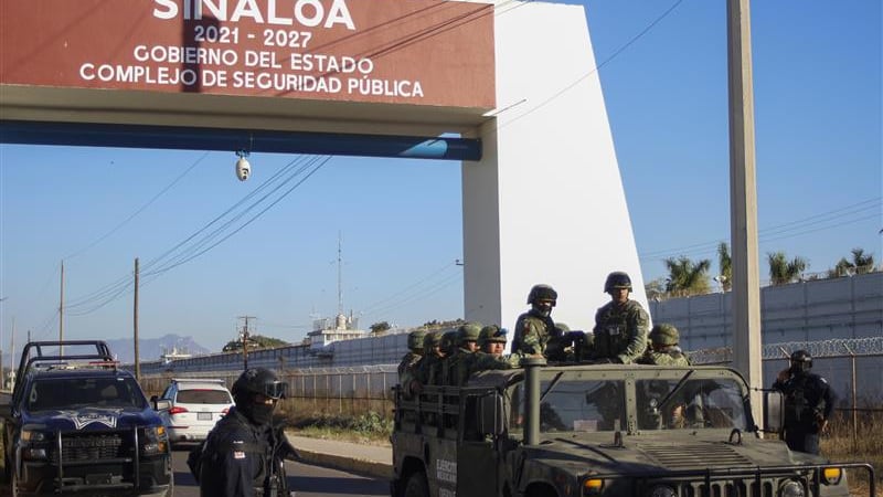 FILE - Police and military patrol Culiacan, Sinaloa state, Mexico, Jan. 6, 2023, the day after...