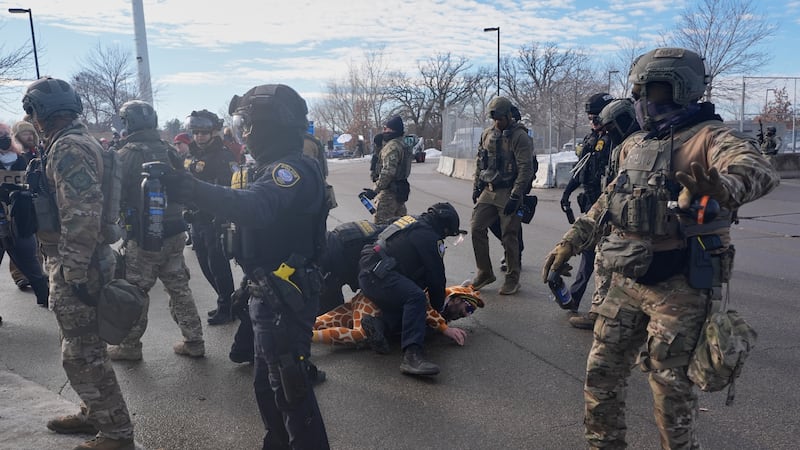 Protesters demonstrate against Immigration and Customs Enforcement (ICE) after Renee Good, who...