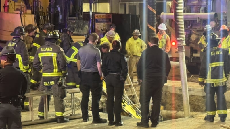 Atlanta construction worker falls in hole.