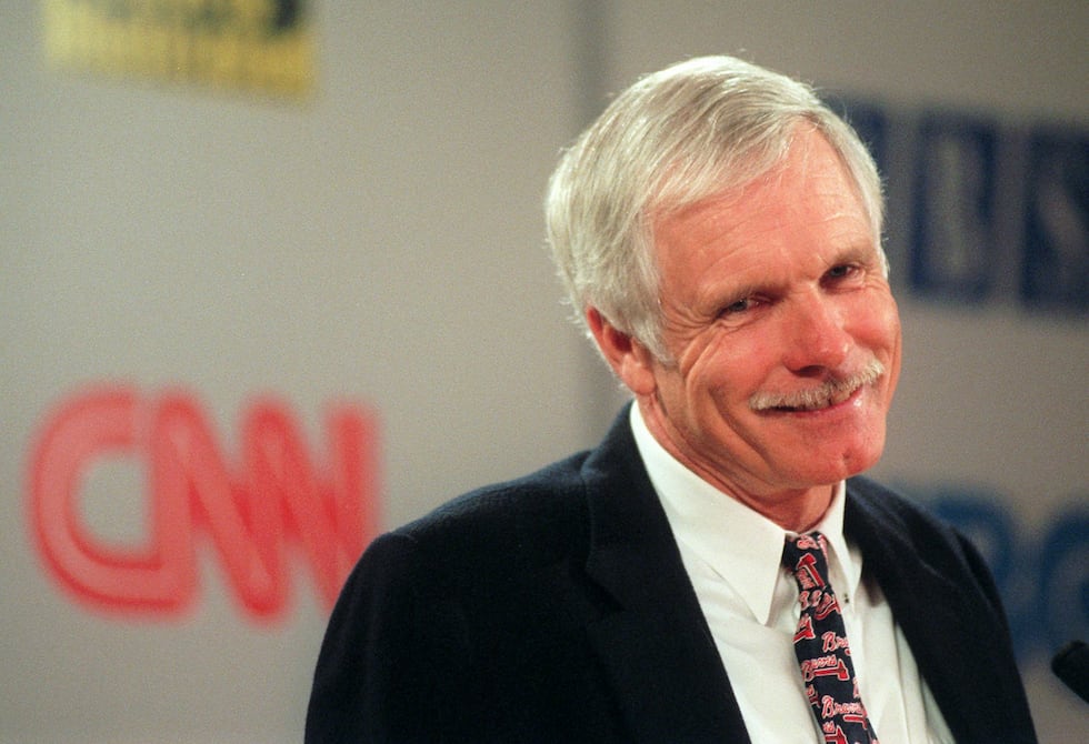 Ted Turner smiles during a special meeting of Turner Broadcasting System shareholders...
